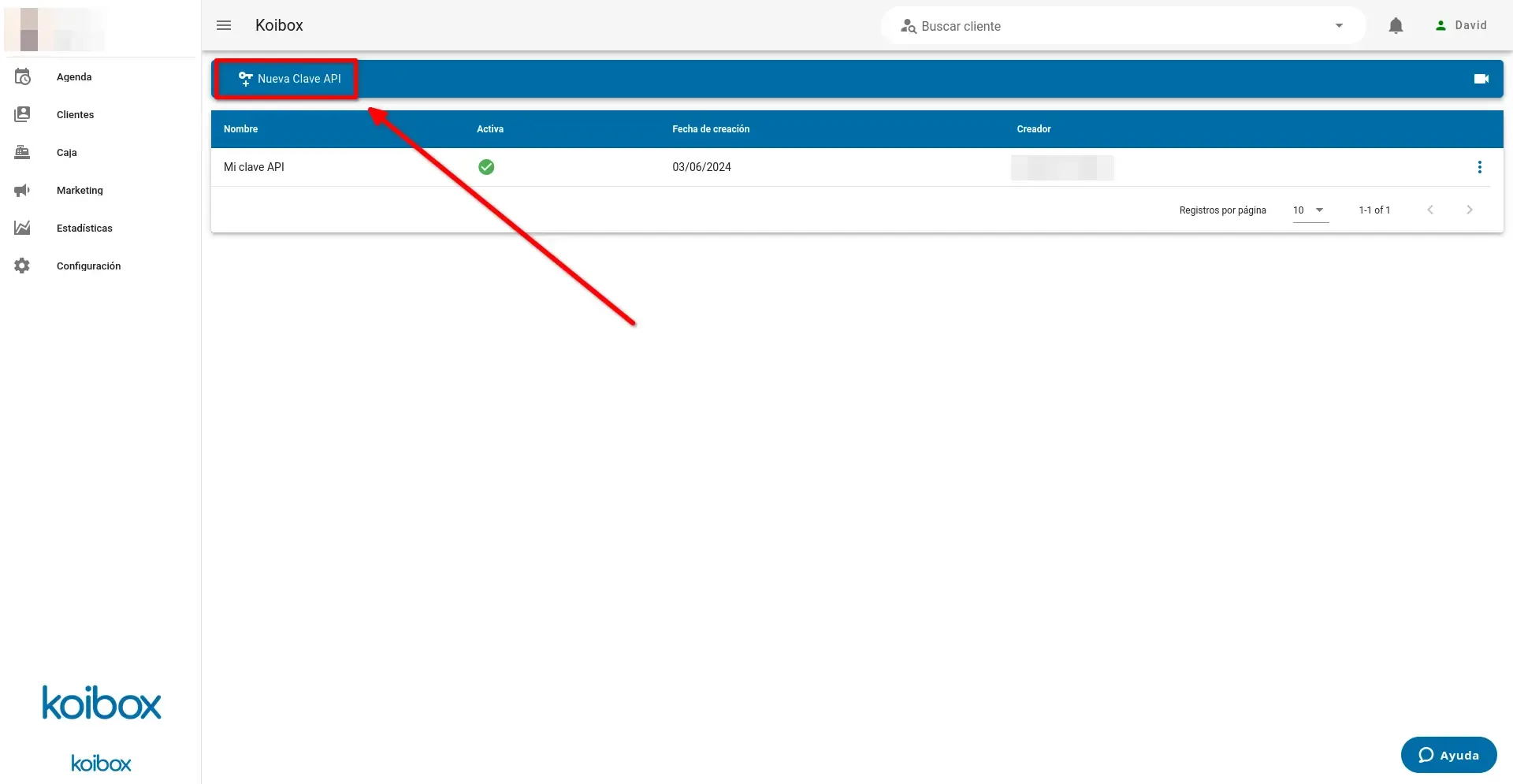 Koibox panel showing a list of a center's API keys, with an arrow pointing to the button to create keys.